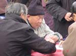 old men playing cards in peoples park